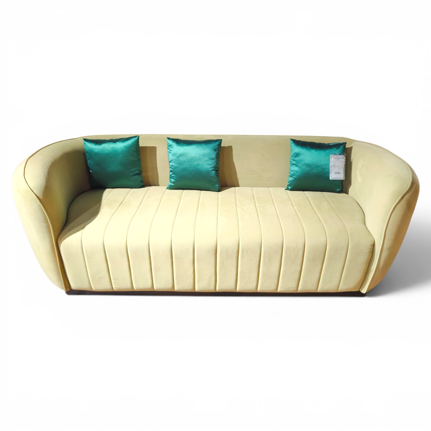 Curved Modern Sofa in Cream Upholstery with Teal Accent Pillows