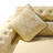 Elegant Tufted Beige Loveseat with Diamond‑Pattern Accent Pillows
