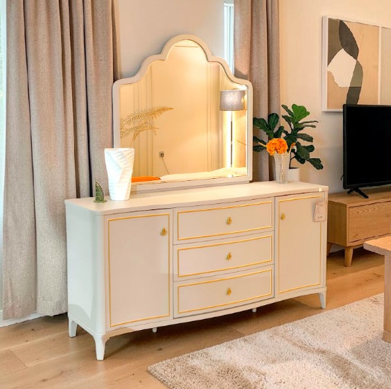 Elegant Beige Dresser with Gold Trim and Curved Mirror Frame
