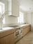 White Oak & Quartzite Timeless Kitchen with Airy Modern Elegance