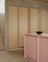 Light oak kitchen with pink kitchen island