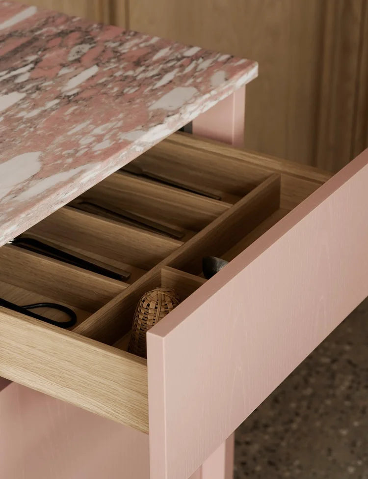 Light oak kitchen with pink kitchen island