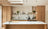 Contemporary Light Oak Scandinavian Kitchen with Natural Wood Finishes