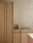 Light oak kitchen with pink kitchen island