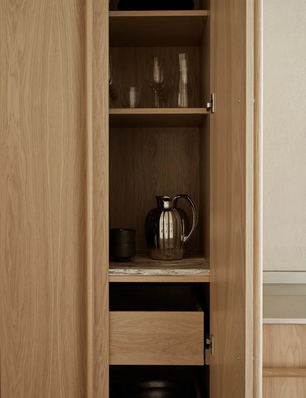 Light oak kitchen with pink kitchen island