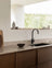 Minimalist timber kitchen with dark oak cabinetry