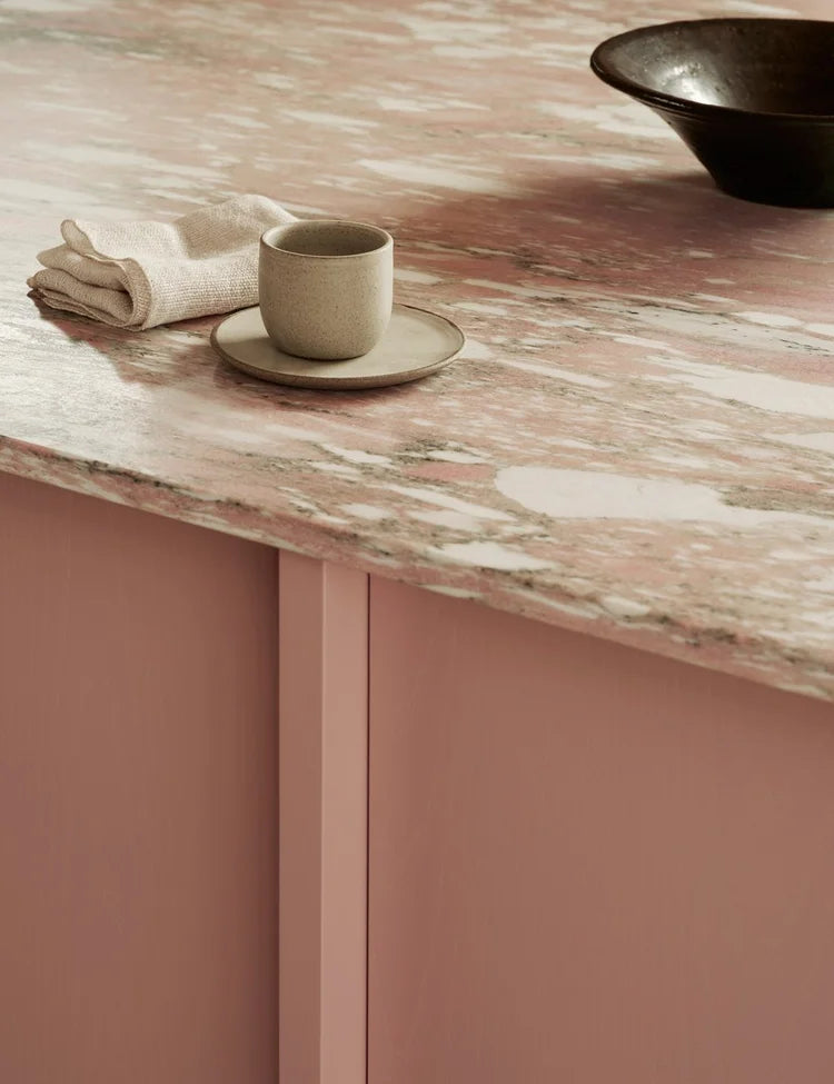 Light oak kitchen with pink kitchen island